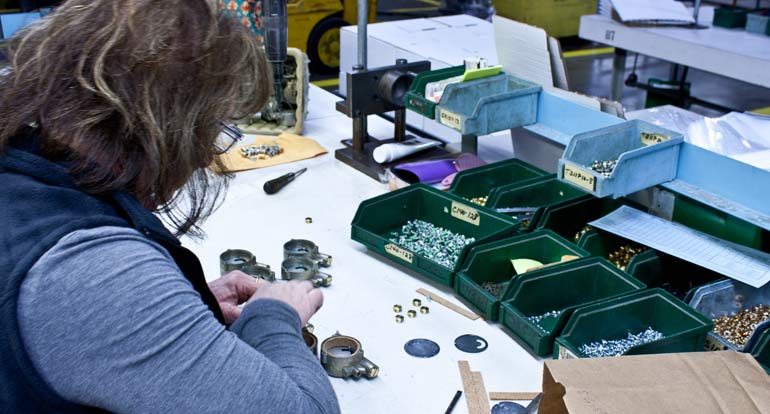 A skilled worker assembling components